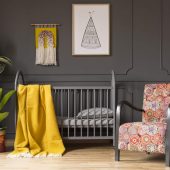 patterned-armchair-next-to-kids-bed-with-yellow-bl-N6F9MGS-scaled.jpg